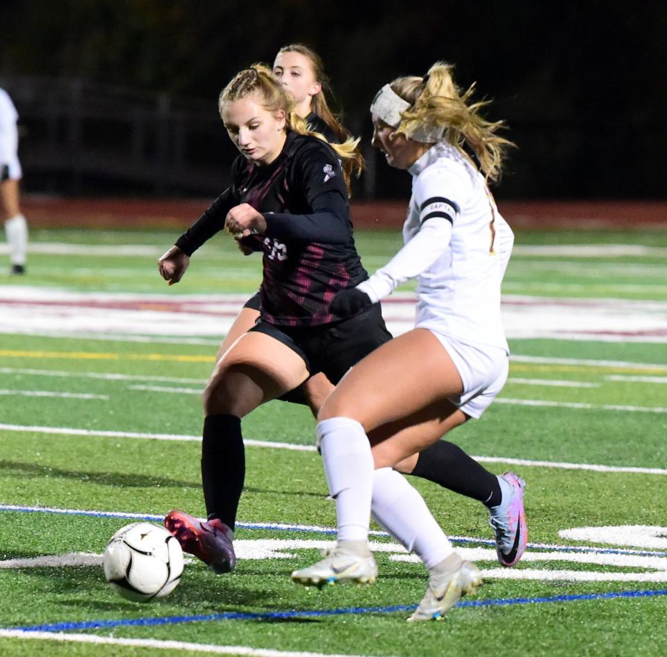 Elmira's Lilly Rice, left, and Arlington's Ava Santarpia battle for possession during Arlington's 6-0 victory in a Class AAA girls soccer subregional Nov. 1 2023 at Johnson City High School
