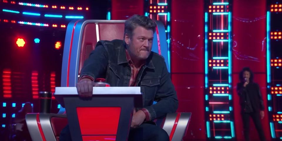 Blake Shelton sitting on the show