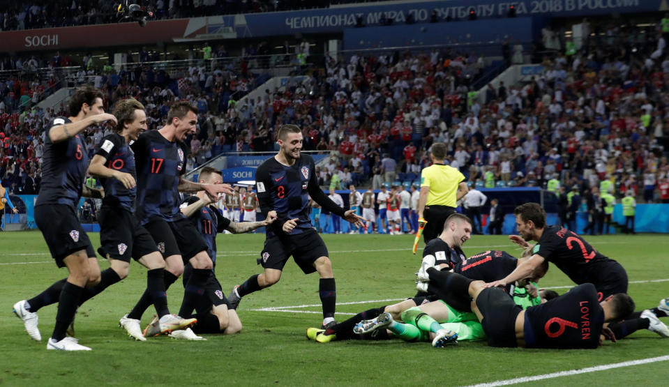 <p>Croatia players celebrate after winning the penalty shootout 4-3 </p>