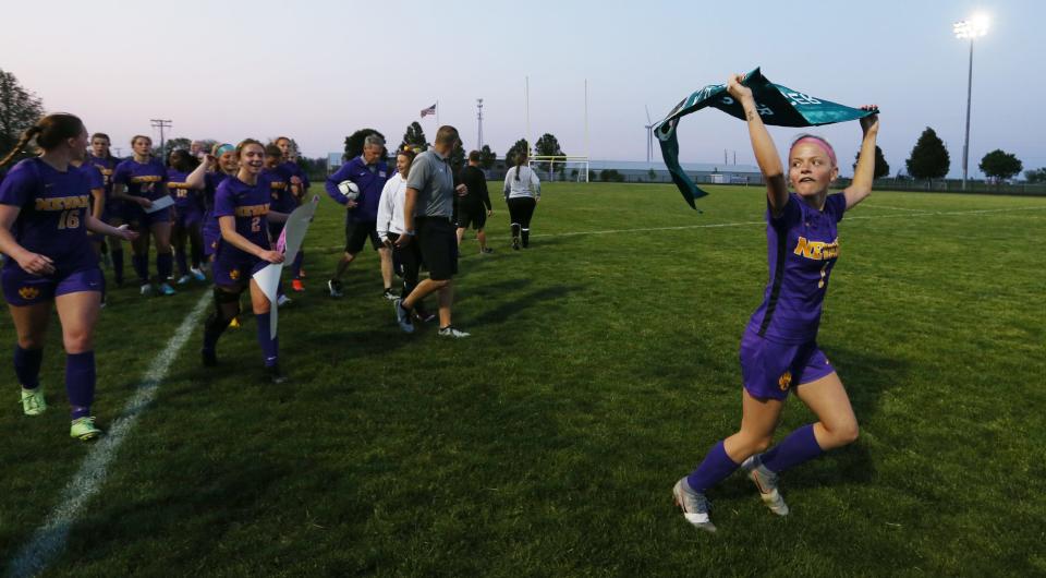 Nevada forward Kaleigh Groat (1) celebrates with the Cubs' 1A girls state soccer qualifying banner after they defeated Center Point-Urbana, 1-0, during the 1A regional final game at Cub Stadium Thursday, May 25, 2023, in Nevada, Iowa.
