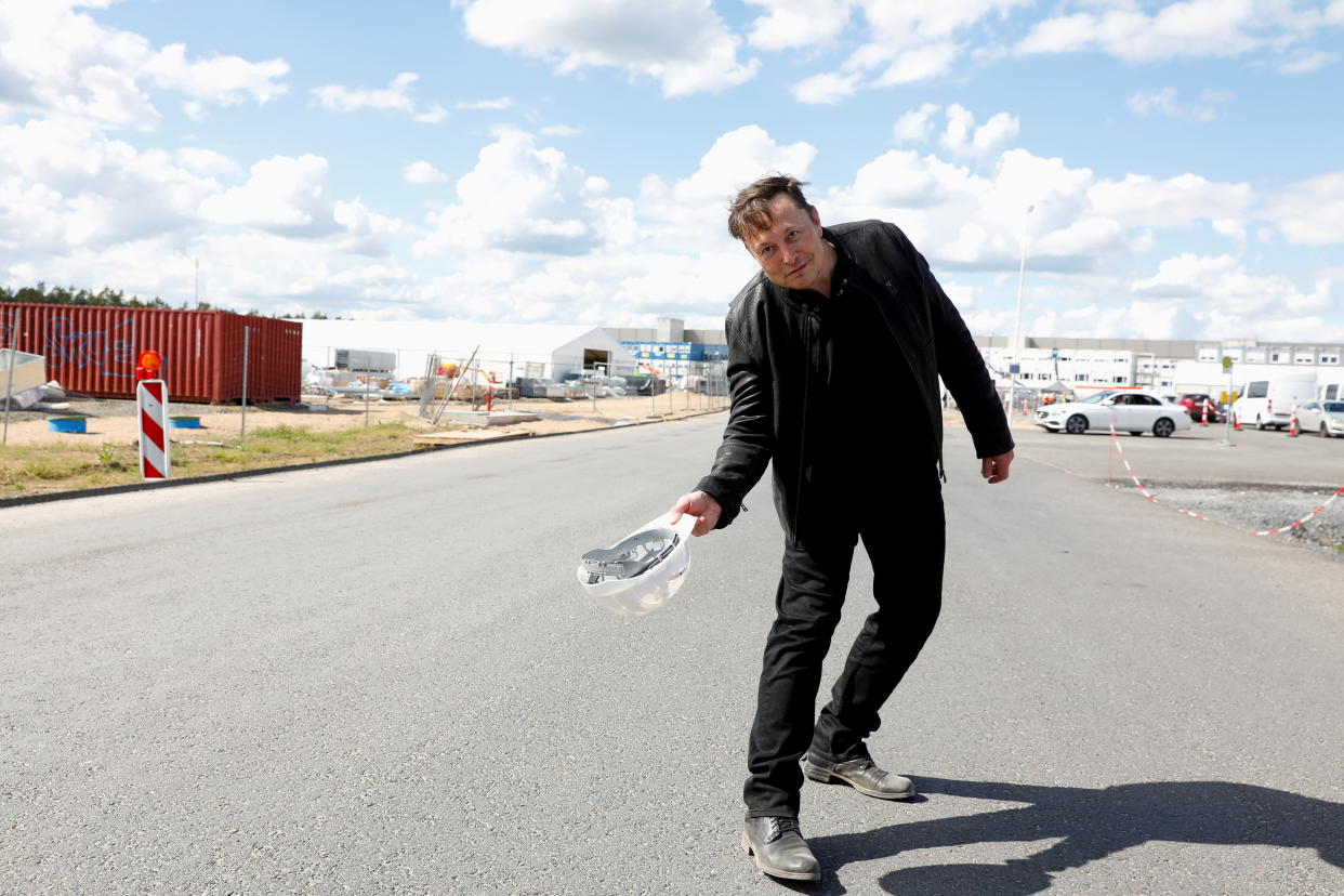 SpaceX founder and Tesla CEO Elon Musk holds a helmet as he visits the construction site of Tesla's gigafactory in Gruenheide, near Berlin, Germany, May 17, 2021. REUTERS/Michele Tantussi     TPX IMAGES OF THE DAY