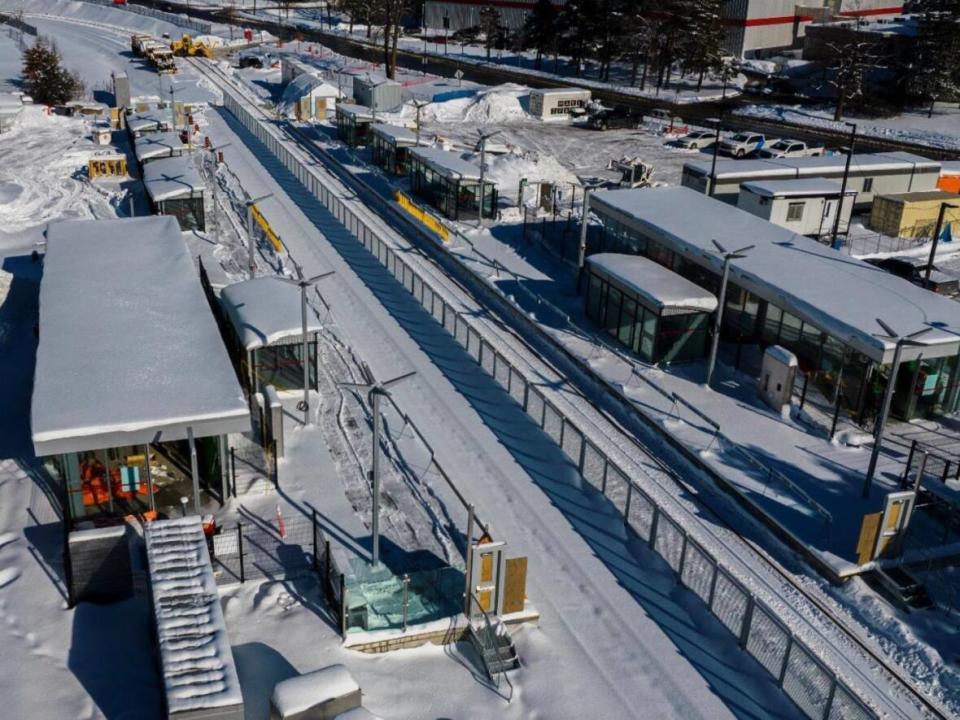 The new O-Train station at Carleton University was shown wrapped for wintertime construction in slide show images shared with city councillors on March 29, 2023. (City of Ottawa - image credit)