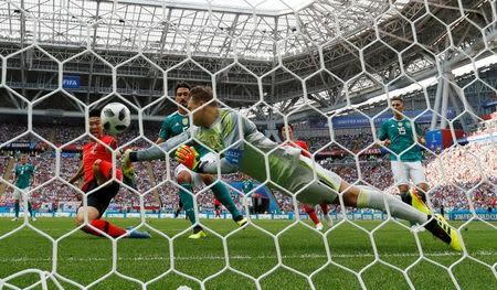 Soccer Football - World Cup - Group F - South Korea vs Germany - Kazan Arena, Kazan, Russia - June 27, 2018 Germany's Manuel Neuer punches the ball away from South Korea's Son Heung-min REUTERS/John Sibley