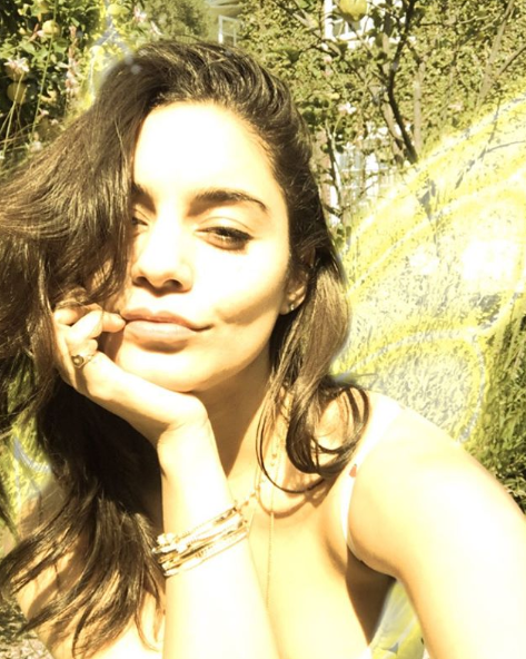 Vanessa Hudgens smiles in a selfie taken outdoors