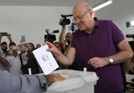 Lebanon's former Prime Minister and a candidate for the parliamentary election Najib Mikati, casts his vote at a polling station in Tripoli, northern Lebanon, May 6, 2018. REUTERS/Omar Ibrahim