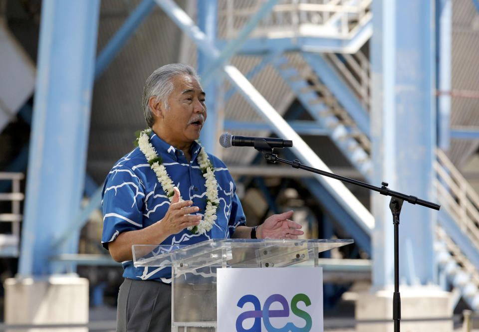 Hawaii Gov. David Ice speaks at the AES Corporation's coal-fired power plant in Kapolei, Hawaii during a ceremony to mark the closure of the facility, Thursday, Aug. 18, 2022. As Hawaii transitions toward its goal of achieving 100% renewable energy by 2045, the state's last coal-fired power plant closed this week ahead of a state law that bans the use of coal as a source of electricity beginning in 2023. (AP Photo/Caleb Jones)