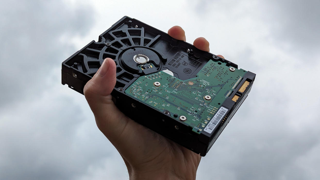  Western Digital SATA mechanical hard drive in hand. 