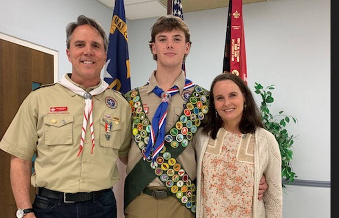 Briar McLellan and his parents, Ken and Kim, celebrating his merit badge achievement. Courtesy of the McLellan family