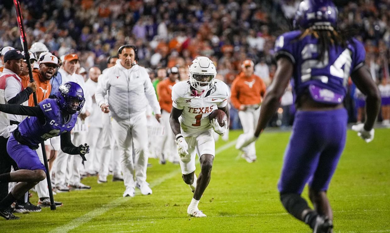 Texas Longhorns wide receiver Xavier Worthy (1) runs for the first down against TCU Horned Frogs in the second quarter of an NCAA college football game, Saturday, November. 11, 2023, at Amon G. Carter Stadium in Fort Worth, Texas.