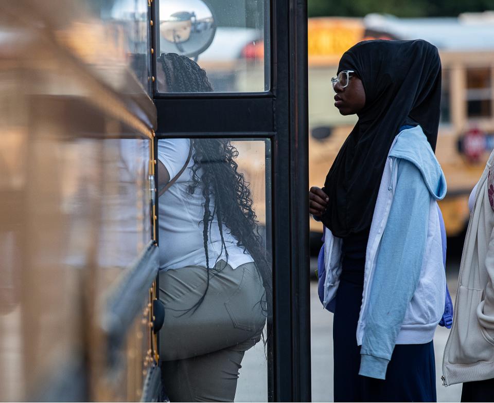 JCPS students transferred buses at the JCPS Detrick Bus Compound on the first day of school on Wednesday, Aug. 9, 2023