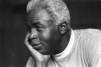 FILE - In this June 30, 1971, file photo, Jackie Robinson poses at his home in Stamford, Conn. Baseball holds tributes across the country on Jackie Robinson Day, Tuesday, April 15, 2014, the 67th anniversary marking the end of the game's racial barrier. (AP Photo/File)
