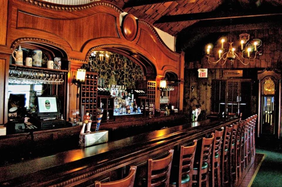 <p>You can't help but belly up to the 35-foot mahogany bar at this <a href="https://go.redirectingat.com?id=74968X1596630&url=https%3A%2F%2Fwww.tripadvisor.com%2FRestaurant_Review-g36282-d2394984-Reviews-The_Village_Tavern-Long_Grove_Lake_County_Illinois.html&sref=https%3A%2F%2Fwww.redbookmag.com%2Ffood-recipes%2Fg34142495%2Foldest-restaurants-america%2F" rel="nofollow noopener" target="_blank" data-ylk="slk:Long Grove tavern;elm:context_link;itc:0;sec:content-canvas" class="link ">Long Grove tavern</a>. It's been in operation since 1849, and people still love it for the live entertainment and specials like prime rib and an all-you-can-eat fish fry.</p>
