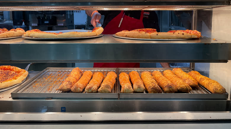 Costco chicken bakes at food court beneath pizza