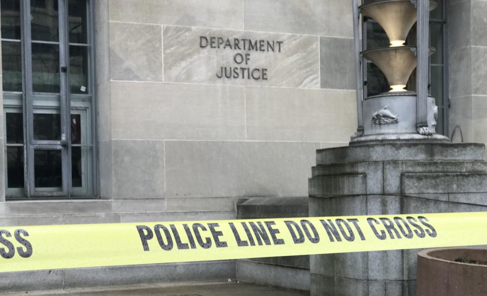 Police tape in front of Justice Department headquarters (Photo: Ryan J. Reilly/HuffPost)