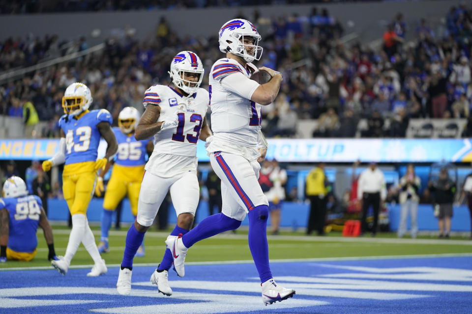 Buffalo Bills quarterback Josh Allen (17) scores a rushing touchdown during the first half of an NFL football game against the Los Angeles Chargers, Saturday, Dec. 23, 2023, in Inglewood, Calif. (AP Photo/Ashley Landis)