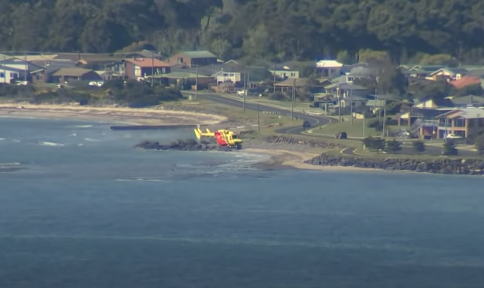 A Surf Life Saving helicopter patrols waters northwest of Tasmania.