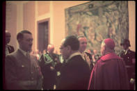 Hitler at New Year's reception in the Chancellery. At right with back to camera, Vatican minister. (Photo by Hugo Jaeger/Timepix/Time Life Pictures/Getty Images)