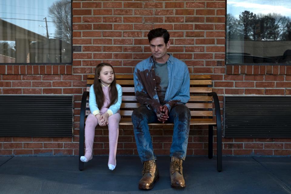 Henry Thomas (with Violet McGraw) plays the patriarch of a family that moves into a creepy mansion in the Netflix series "The Haunting of Hill House."