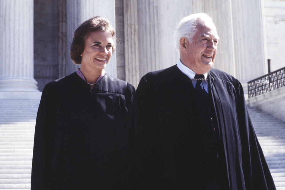 FILE - Supreme Court Associate Justice Sandra Day O'Connor poses with Chief Justice Warren Burger after her swearing in at the Supreme Court in Washington, Sept. 25, 1981. O'Connor, who joined the Supreme Court in 1981 as the nation's first female justice, has died at age 93. (AP Photo/Ron Edmonds, File)