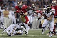 San Francisco 49ers running back Frank Gore (21) runs with the ball for an 18-yard gain during the first quarter of an NFL football game as St. Louis Rams linebacker James Laurinaitis, right, gives chase Thursday, Sept. 26, 2013, in St. Louis. (AP Photo/Charlie Riedel)