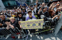 LOS ANGELES, CA - JUNE 14: Fans cheer for the Los Angeles Kings team menbers during the Stanley Cup victory parade on June 14, 2012 in Los Angeles, California. The Kings are celebrating their first NHL Championship in the team's 45-year-old franchise history. (Photo by Kevork Djansezian/Getty Images)