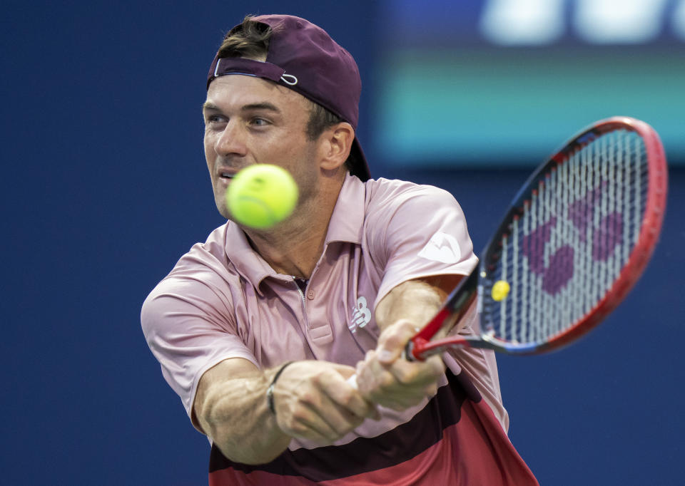 Tommy Paul, of the United States, hits a return to Carlos Alcaraz, of Spain, during the National Bank Open men’s tennis tournament Friday, Aug. 11, 2023, in Toronto. (Frank Gunn/The Canadian Press via AP)