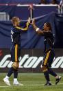 EAST RUTHERFORD, NJ - AUGUST 18: David Beckham #23 of the Los Angeles Galaxy celebrates with Carlos Pavon #20 after their first goal against the New York Red Bulls at Giants Stadium on August 18, 2007 in East Rutherford, New Jersey. (Photo by Mike Ehrmann/Getty Images for Red Bulls)