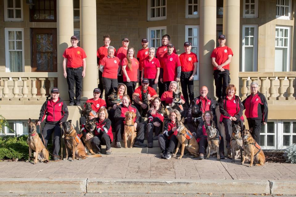 Members of the Search and Rescue Dog Association of Alberta gather in October 2023.