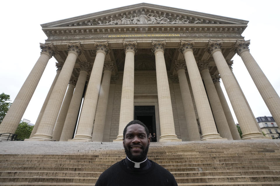 Jason Nioka, a former judo champion and deacon who's in charge of the largest contingent of Olympic chaplains, about 40 priests, nuns and lay Catholics, poses outside the Madeleine church, Thursday, May 30, 2024 in Paris. As athletes rev up their training and organizers finalize everything from ceremonies to podiums before the Paris Olympics, more than 120 faith leaders are preparing for a different challenge – spiritually supporting some 14,000 participants from around the world, especially those whose medal dreams will inevitably get crushed. (AP Photo/Michel Euler)