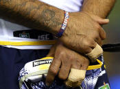 Cowboys star Johnathan Thurston wearing a 'Rise for Alex' wristband.