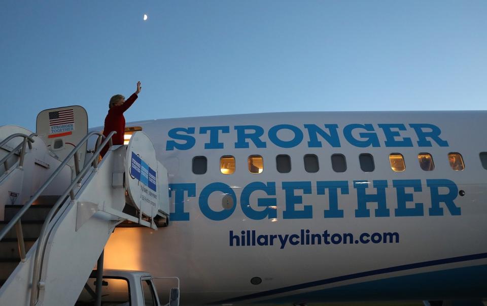 Hillary Clinton boards a campaign jet in Grand Rapids, Mich., the day before she lost the 2016 election to Donald Trump.
