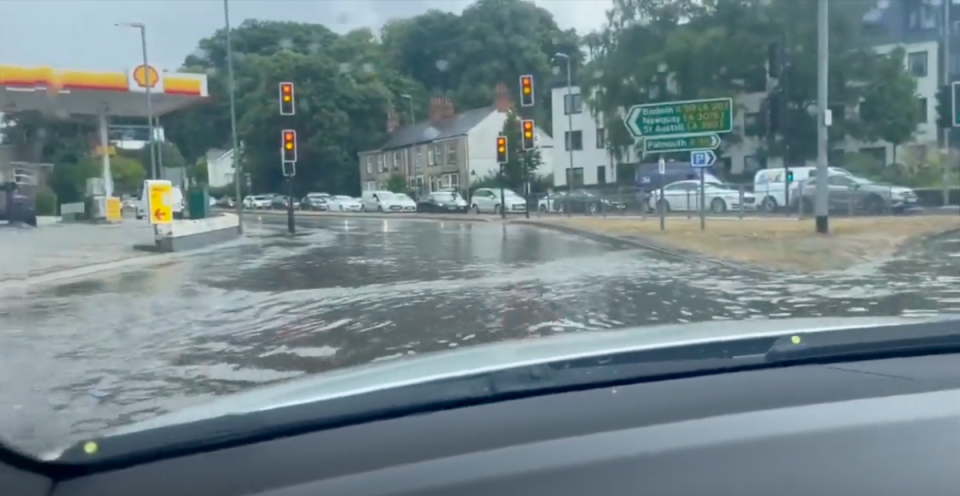 Drivers in Truro, Cornwall had to drive with caution around the flooded roundabout (Oliver Dobbs)