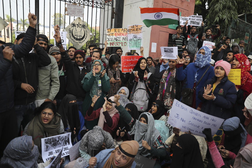 Indian students of the Jamia Millia Islamia University shout slogans as they march during a protest, in New Delhi, India, Wednesday, Dec. 18, 2019. India’s Supreme Court on Wednesday postponed hearing pleas challenging the constitutionality of the new citizenship law that has sparked opposition and massive protests across the country. (AP Photo/Altaf Qadri)