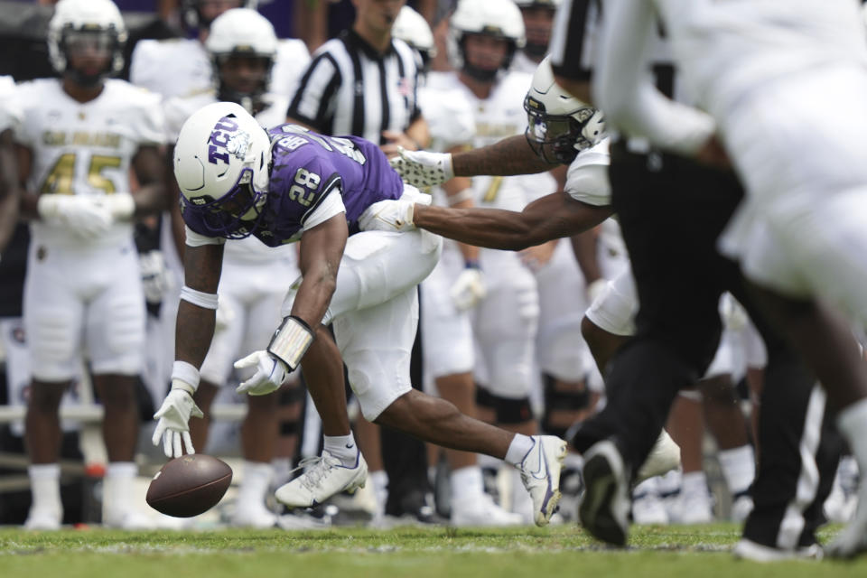 TCU safety Millard Bradford (28) chases a fumble during the first half of an NCAA college football game against Colorado Saturday, Sept. 2, 2023, in Fort Worth, Texas. TCU recovered the ball on the play. (AP Photo/LM Otero)