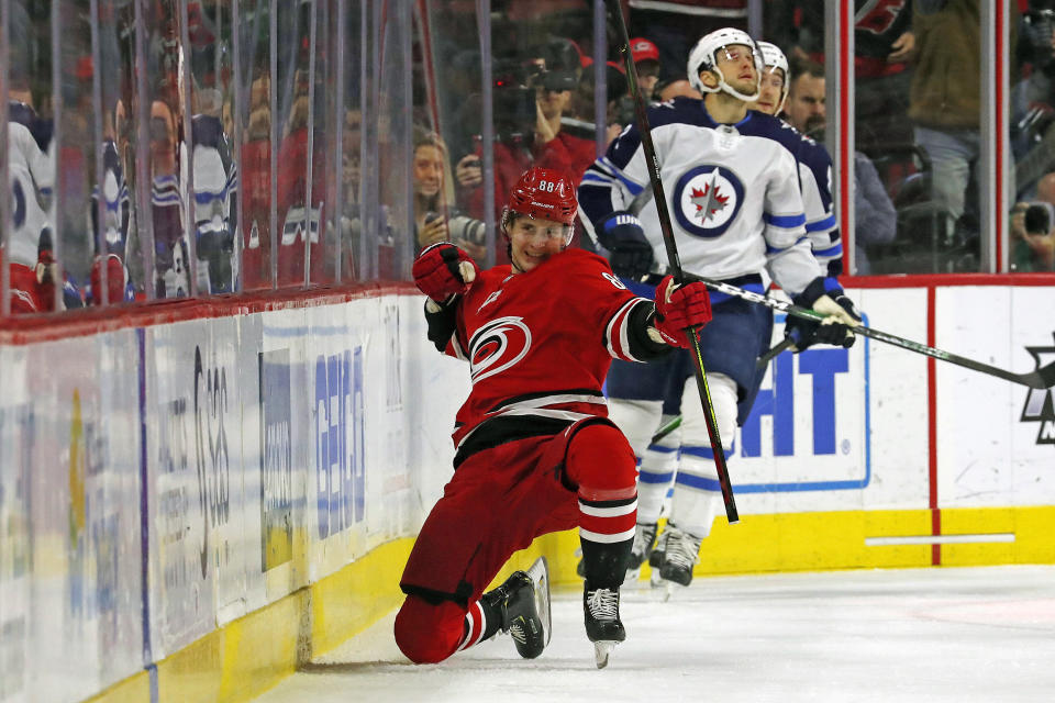 Carolina Hurricanes' Martin Necas (88), of the Czech Republic, celebrates his goal against the Winnipeg Jets during the first period of an NHL hockey game in Raleigh, N.C., Tuesday, Jan. 21, 2020. (AP Photo/Karl B DeBlaker)