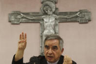 Cardinal Angelo Becciu talks to journalists during press conference in Rome, Friday, Sept. 25, 2020. The powerful head of the Vatican's saint-making office, Cardinal Angelo Becciu, has resigned from the post and renounced his rights as a cardinal amid a financial scandal that has reportedly implicated him indirectly. (AP Photo/Gregorio Borgia)