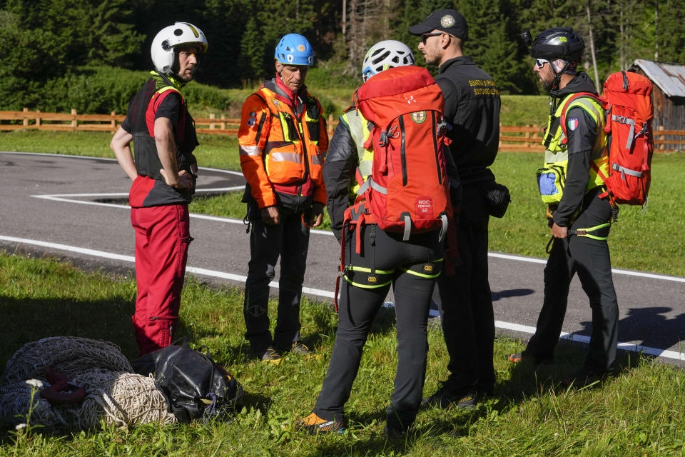 Rescuers prepare to conduct searches for the victims of the Punta Rocca glacier avalanche in Canazei, in the Italian Alps in northern Italy, Tuesday, July 5, 2022, two day after a huge chunk of the glacier broke loose, sending an avalanche of ice, snow, and rocks onto hikers. (AP Photo/Luca Bruno)