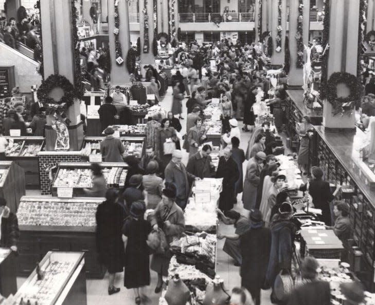 O'Neil's shoppers roam the aisles of the downtown Akron store at Christmas in 1951.