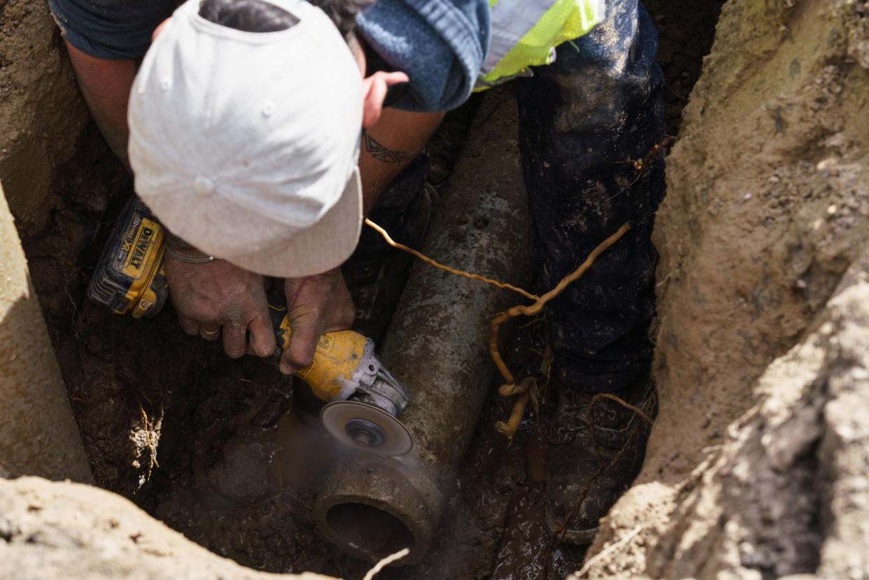 Water Department worker Andrew Curry repairs a pipe in Truth or Consequences, N.M., where new leaks spring up nearly every day. (Paul Ratje for NBC News)