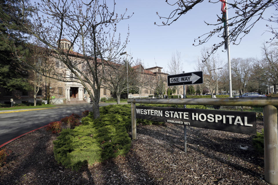 FILE - This April 11, 2017, file photo shows the entrance to Western State Hospital in Lakewood, Wash. A patient with a history of violence was charged with assault Tuesday, Aug. 28, 2018, after he punched a nurse, knocked her to the floor and repeatedly stomped on her head at the Washington state psychiatric hospital that recently lost accreditation and federal funding due to safety violations. (AP Photo/Elaine Thompson, File)