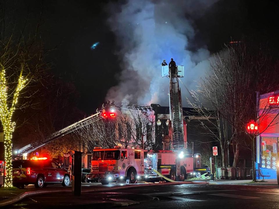 Ladder trucks were used to pour water on top of the fire at Harris Avenue Dec. 17, 2023.