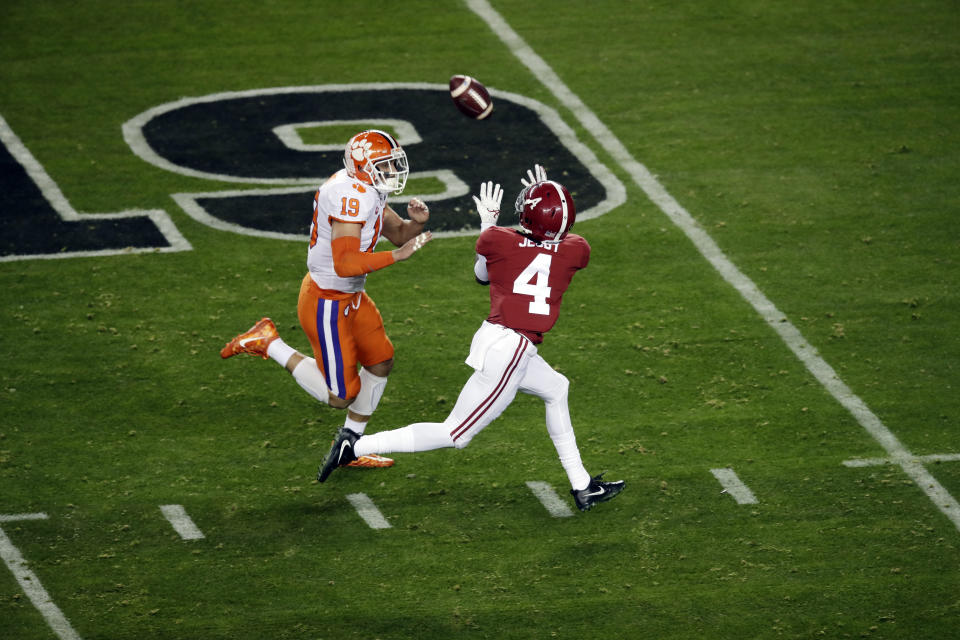 Alabama's Jerry Jeudy catches a touchdown pass in front of Clemson's Tanner Muse during the first half the NCAA college football playoff championship game, Monday, Jan. 7, 2019, in Santa Clara, Calif. (AP Photo/Jeff Chiu)