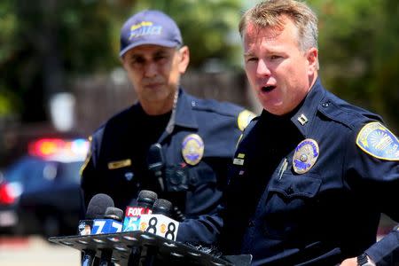 Public Information Officer Captain Lon Turner briefs the media at the scene of an armed standoff with a man with a high powered rifle who is holding hostages in Chula Vista, California May 28, 2015. REUTERS/Sandy Huffaker