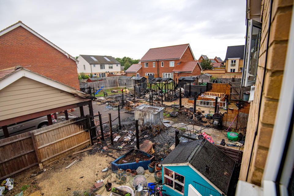 A freak fire left three families homeless after a shard of glass reflected onto a wooden fence (SWNS)