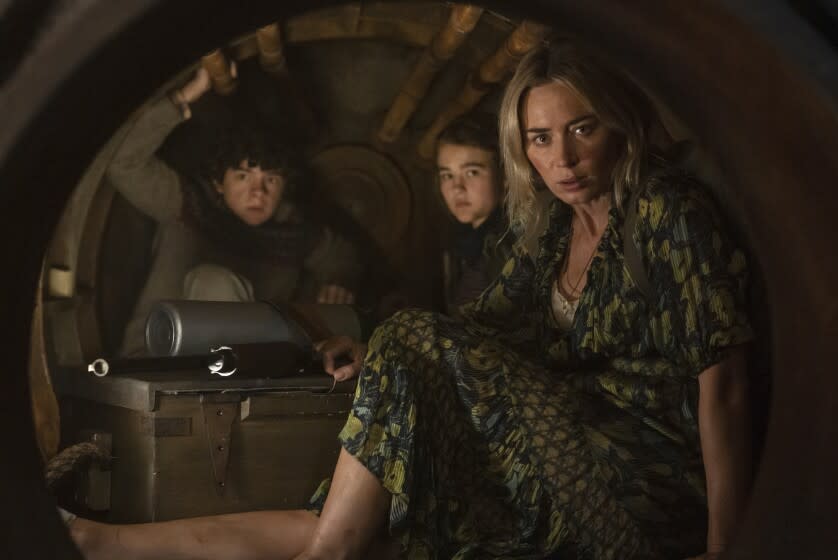 This image released by Paramount Pictures shows, from left, Noah Jupe, Millicent Simmonds and Emily Blunt in a scene from "A Quiet Place Part II." (Jonny Cournoyer/Paramount Pictures via AP)