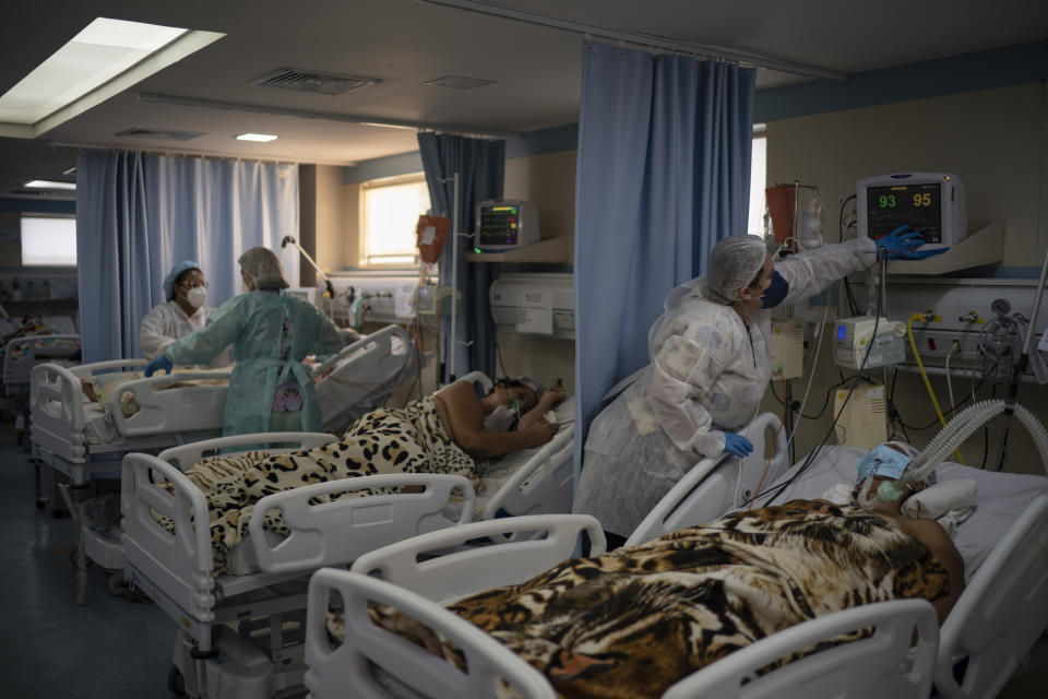 COVID-19 patients are treated in the ICU of the Sao Jose municipal hospital, in Duque de Caxias, Brazil, Wednesday, March 24, 2021. (AP Photo/Felipe Dana)