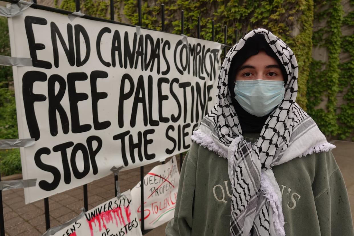 Yara Hussein is one of the encampment organizers at Queen's University. She says the protests will continue until the school agrees to their demands. (Dan Taekema/CBC - image credit)
