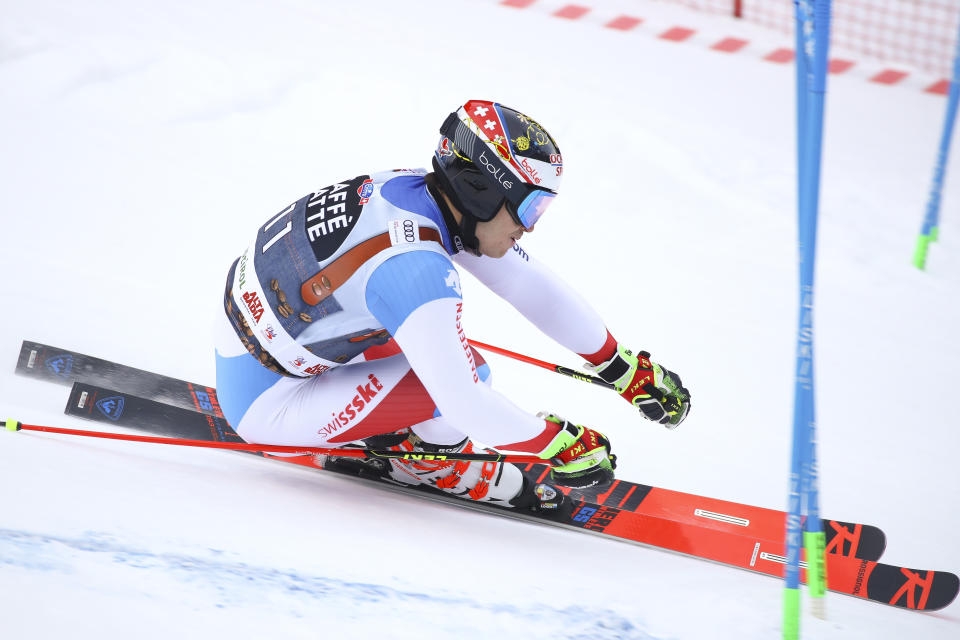 Switzerland's Loic Meillard speeds down the course during a men's World Cup Giant Slalom, in Alta Badia, Italy, Sunday, Dec. 16, 2018. (AP Photo/Alessandro Trovati)