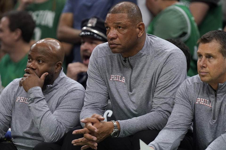 Philadelphia 76ers head coach Doc Rivers, center, watches from the bench as the 76ers trail the Boston Celtics during the second half of Game 7 in the NBA basketball Eastern Conference semifinal playoff series, Sunday, May 14, 2023, in Boston. (AP Photo/Steven Senne)