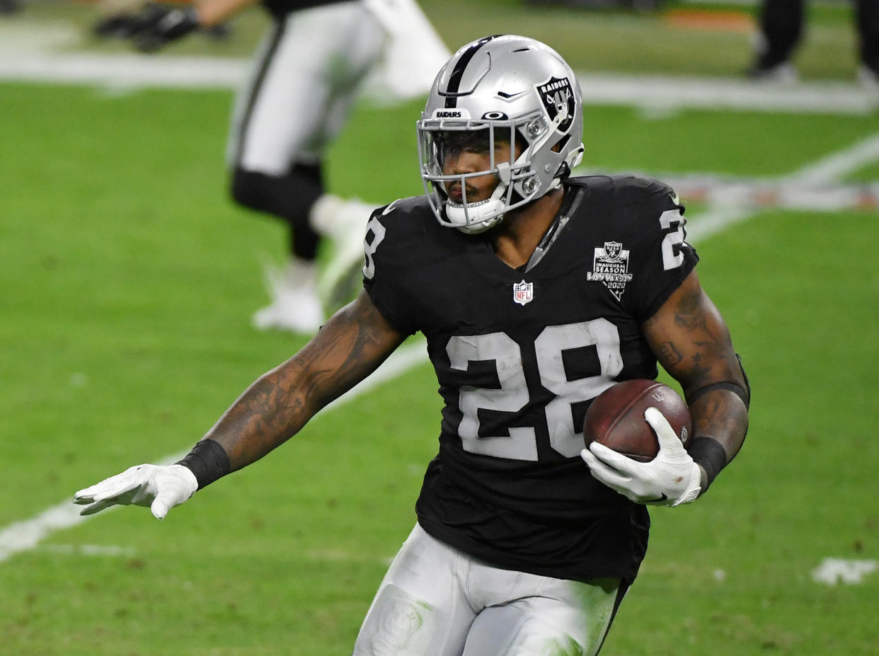 LAS VEGAS, NEVADA - DECEMBER 26:  Running back Josh Jacobs #28 of the Las Vegas Raiders runs against the Miami Dolphins in the second half of their game at Allegiant Stadium on December 26, 2020 in Las Vegas, Nevada. The Dolphins defeated the Raiders 26-25.  (Photo by Ethan Miller/Getty Images)